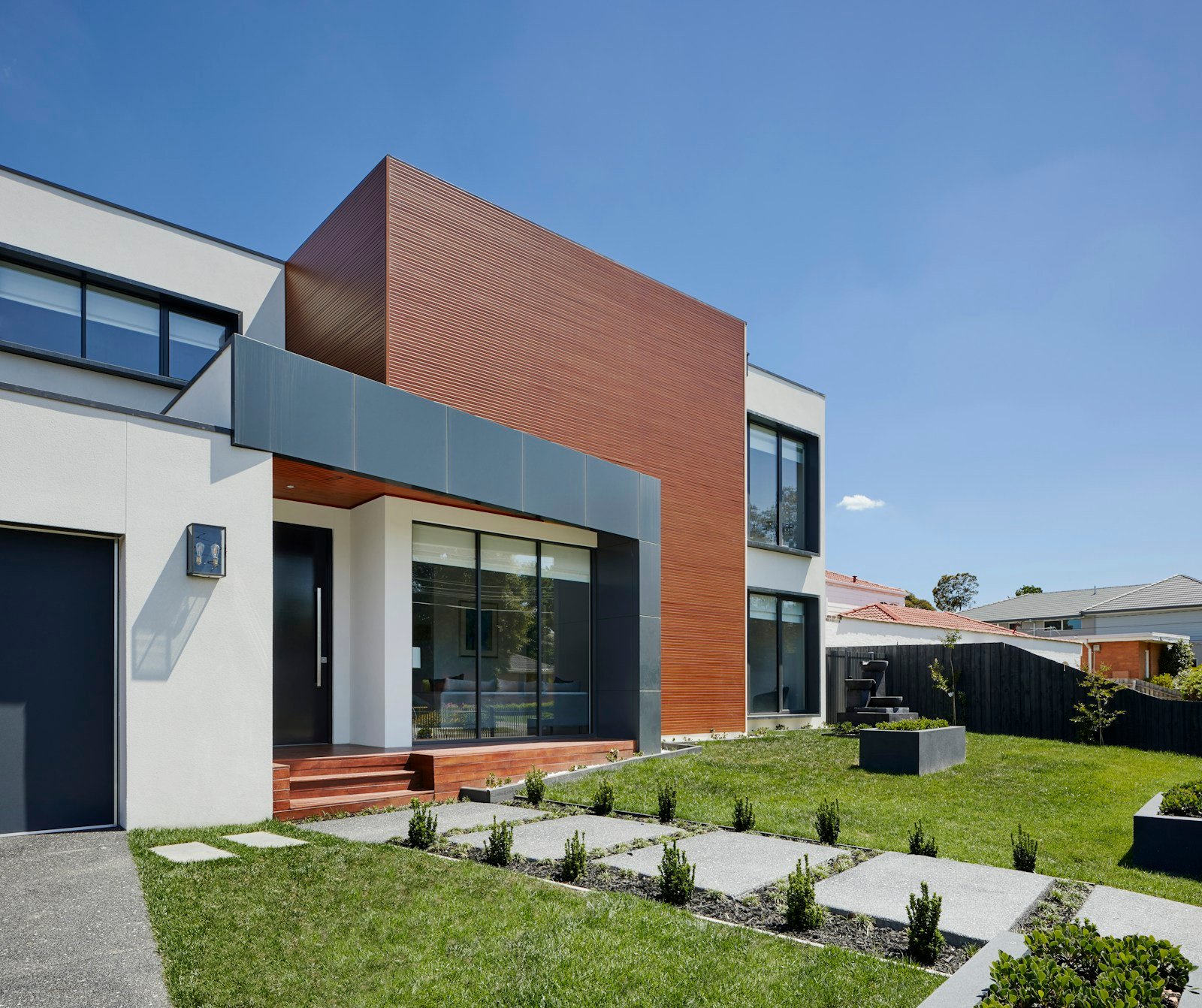 Illustrative home architecture with landscaped outdoor space